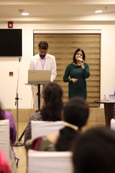 pexels photo 31770764 31770764 Business professionals presenting at a corporate event in Ahmedabad, India.